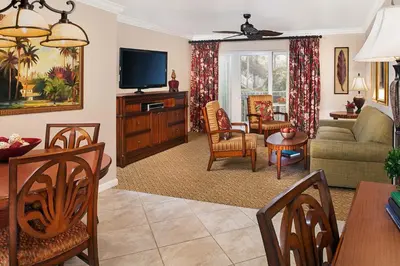 a living room with a couch and a tv at Sheraton Vistana Resort Villas, Lake Buena Vista Orlando in Orlando