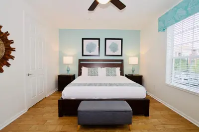 a bedroom with a bed and a ceiling fan at Vista Cay at Epic Universe - Luxury 4 bedroom condo in Orlando