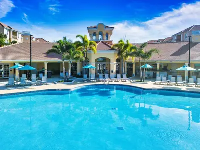 a large swimming pool in front of a hotel at Vista Cay at Epic Universe - Luxury 4 bedroom condo in Orlando