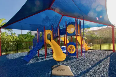 a playground with a slide in a park at Vista Cay at Epic Universe - Standard 3 bedroom condo in Orlando