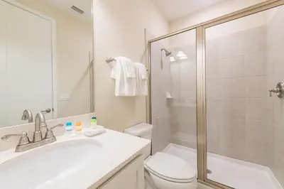 a bathroom with a sink and a toilet and a shower at Livin' For The Weekend Cottage Near Disney With Margaritaville Resort & Island H2O Access - 8021Ff in Orlando