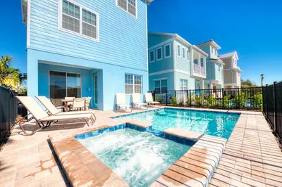 a swimming pool in the backyard of a house at Blue Oasis Cottage With Private Pool Near Disney And Margaritaville Resort & Island H20 Access - 7968Sh in Orlando