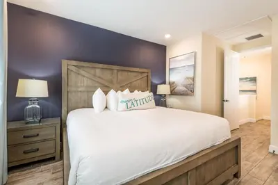 a bedroom with a large bed with white sheets at Blue Oasis Near Disney With Margaritaville Resort & Island H2O Access - 8049Sh in Orlando