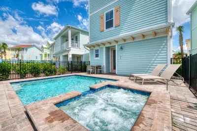a swimming pool in front of a house at Coral Waves Cottage With Private Pool Near Disney With Margaritaville Resort & Island H2O Access - 8040Sh in Orlando