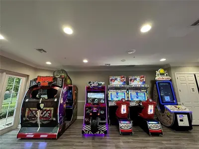 a room with many arcade games in it at 13-403 Your Vista Cay Home in Orlando