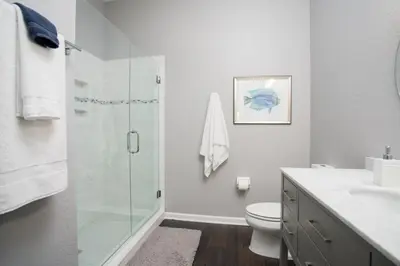 a bathroom with a glass shower and a toilet at 2-403 Your Vista Cay Condo in Orlando