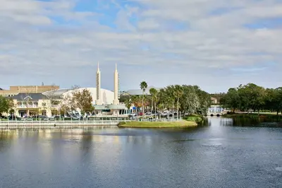 a large body of water with a building and a city at The Inn at Celebration, Autograph Collection in Orlando