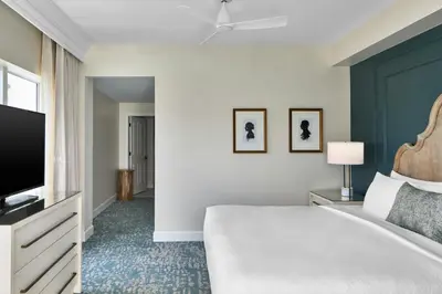 a bedroom with a bed and a flat screen tv at The Inn at Celebration, Autograph Collection in Orlando
