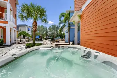 a hot tub in the backyard of a house at Teenie Bikini Cottage With Private Hot Tub Near Disney With Margaritaville Resort & Island H2O Access - 3071Kl in Orlando