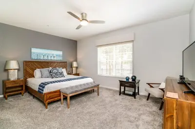a bedroom with a bed and a flat screen tv at Orlando Escape in Orlando