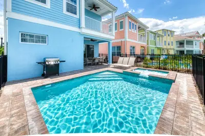 a swimming pool in the backyard of a house at Waterfront Cottage With Private Pool Near Disney And Margaritaville Resort & Island H20 Access - 7985Su in Orlando