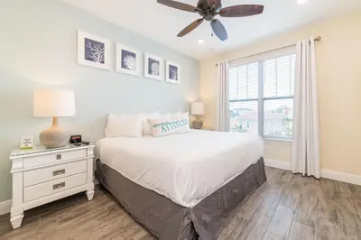a bedroom with a bed and a ceiling fan at Bon Voyage Cottage With Private Pool Near Disney With Margaritaville Resort & Island H2O Access - 8045Su in Orlando