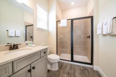 a bathroom with a shower and a toilet and a sink at Casa Del Mar Cottage Near Disney With Margaritaville Resort & Island H2O Access - 8009Ff in Orlando
