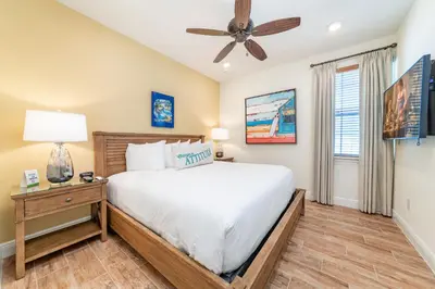 a bedroom with a bed and a ceiling fan at Blissful Oasis With Private Pool Near Disney With Margaritaville Resort & Island H2O Access - 8057Su in Orlando