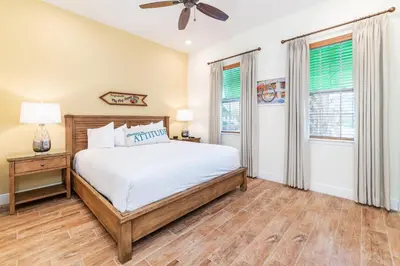 a bedroom with a bed and a ceiling fan at Blissful Oasis With Private Pool Near Disney With Margaritaville Resort & Island H2O Access - 8057Su in Orlando