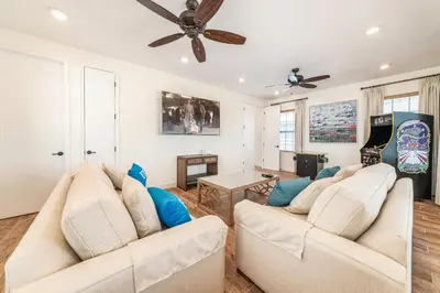 a living room with two white couches and a table at Blissful Oasis With Private Pool Near Disney With Margaritaville Resort & Island H2O Access - 8057Su in Orlando