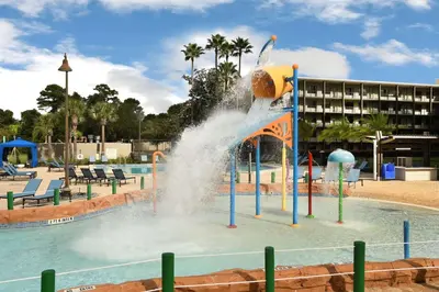 a water fountain in the middle of a pool at Wyndham Lake Buena Vista – Disney Springs® Area in Orlando