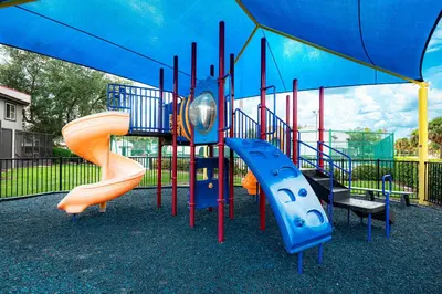 a playground with two slides on at FantasyWorld Resort in Kissimmee