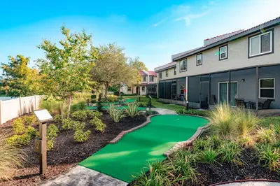 a golf course in front of a house at FantasyWorld Resort in Kissimmee