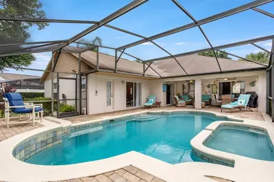 a swimming pool with a glass roof over a house at #503 Stunning 4 Bed, 3 bath villa with southwest facing pool and spa in Orlando