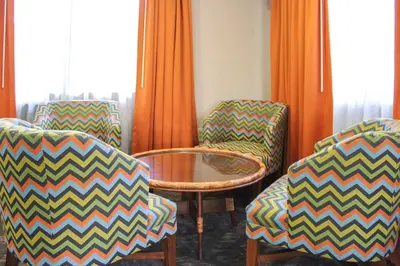 a room with two chairs and a table and a tablektop at Hilton Vacation Club Polynesian Isles Kissimmee in Kissimmee