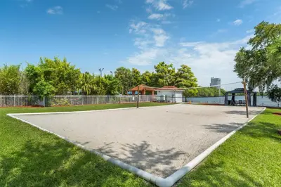 an empty basketball court in a park with grass at Hilton Vacation Club Grand Beach Orlando in Orlando