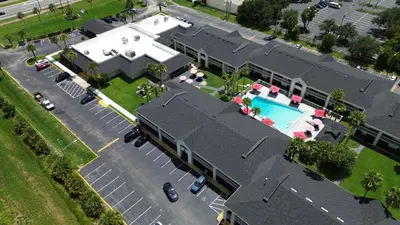 an aerial view of a house with a swimming pool at Disney 12 minutes for family, Pool and parking FREE in Kissimmee