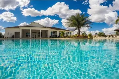 a house in the middle of a pool of water at Amazing Townhouse in gated community 10' to Disney! in Kissimmee