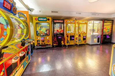 a row of arcade games in a room at Ramada by Wyndham Flamingo Water Park in Kissimmee