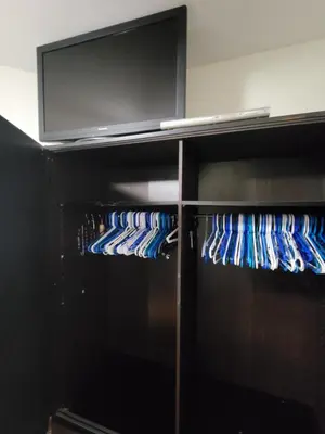 a black refrigerator filled with lots of blue bottles at Lakeview Condo Hotel near Disney in Orlando