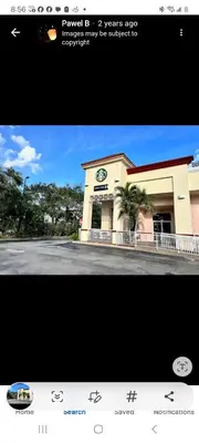 a picture of a building with a clock on it at Lakeview Condo Hotel near Disney in Orlando