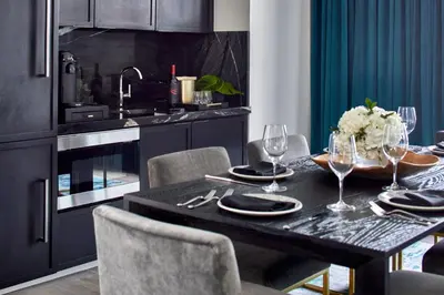 a dining room with a table with wine glasses at Grand Bohemian Orlando, Autograph Collection in Orlando