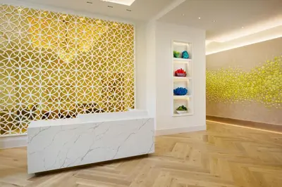 a room with a wall with a painting on it at The Alfond Inn in Orlando