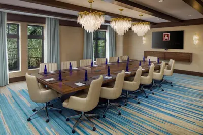 a large conference room with a long table and chairs at The Alfond Inn in Orlando