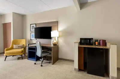 a room with a desk and a chair and a computer at Comfort Suites Near Universal Orlando Resort in Orlando