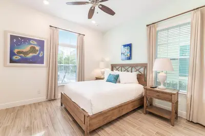 a bedroom with a bed and a window at Sandcastles & Sunshine Cottage With Private Pool Near Disney With Margaritaville Resort & Island H20 Access - 8025Su in Orlando
