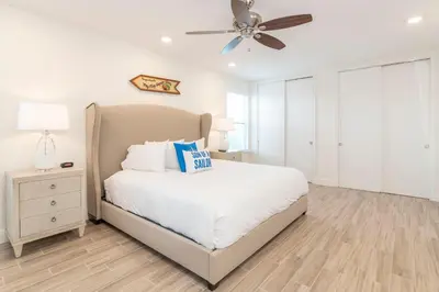 a bedroom with a bed and a ceiling fan at Sandcastles & Sunshine Cottage With Private Pool Near Disney With Margaritaville Resort & Island H20 Access - 8025Su in Orlando