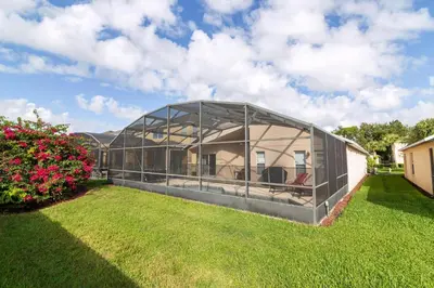 a greenhouse in the yard of a house at Terra Verde Resort!! Private Pool, Game Room, Near Disney And Universal!! in Kissimmee
