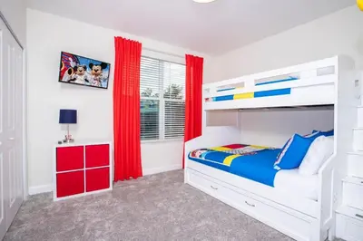 a white bedroom with red curtains and a bunk bed at Gorgeous 5 Bd Single Family Close to Disney @ Storey Lake Resort 2734 in Kissimmee