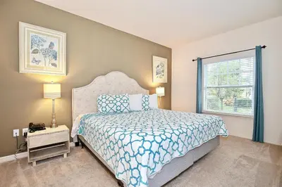 a bedroom with a bed and a window at Great townhouse in great luxurious community, poolgym Close to Disney! in Kissimmee