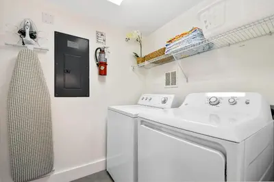 a white laundry room with a washer and dryer at 139PBD-SVH Lovely New Townhome! in Kissimmee