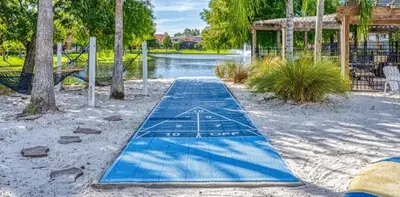a blue paddle board in a park with a pond at 139PBD-SVH Lovely New Townhome! in Kissimmee