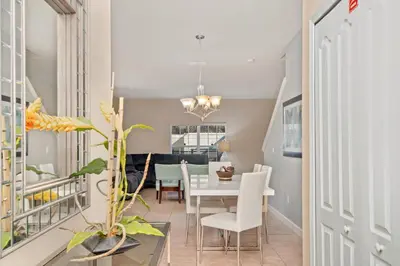 a dining room and living room with a table and chairs at 2947BPD-SVH in Kissimmee