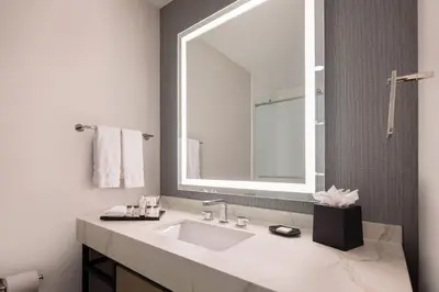 a bathroom with a sink and a mirror at Sheraton Orlando North in Orlando