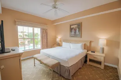 a bedroom with a bed and a window at WorldQuest Orlando Resort in Orlando