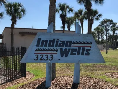 a sign that reads indian wells in a park at Laguna Villas in Kissimmee