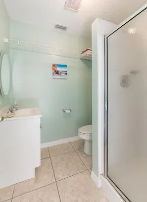 a bathroom with a shower and a toilet at Mickey's Lake Villa 2 in Orlando