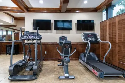 a gym with two treadmills and two ellipticals at Legacy Vacation Resorts Kissimmee & Orlando - Near Disney in Kissimmee