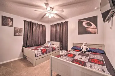 a bedroom with two beds and a ceiling fan at Kissimmee Condo with Resort-Style Amenities! in Kissimmee
