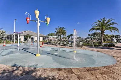 a playground with water fountains in a park at Kissimmee Condo with Resort-Style Amenities! in Kissimmee